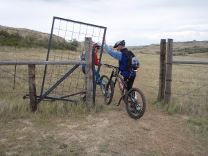 gate that can be opened on horseback, spring loaded when let go it is like a sideways head chopper offer